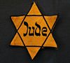 Yellow Star of David badge of the Jew to visually denigrate and to set them apart from the gentiles